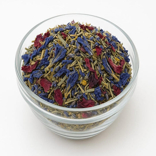 Glass bowl filled with colorful dried flowers on a white background